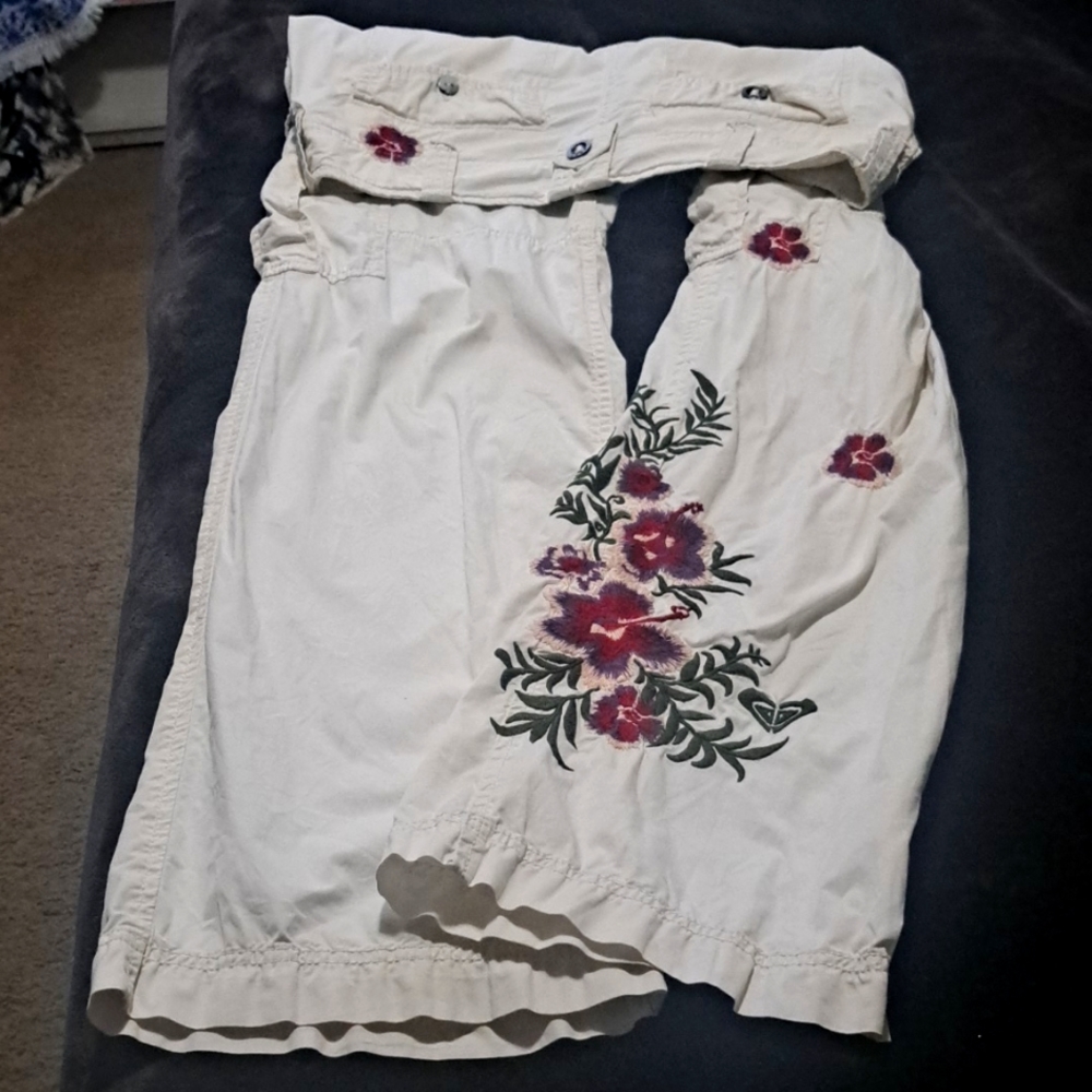 Roxy brand. Size 1. White with embroidered flower of purple, pink, red, green